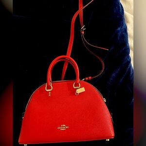 Coach purse with shoulder strap. Never been touched! Great condition.